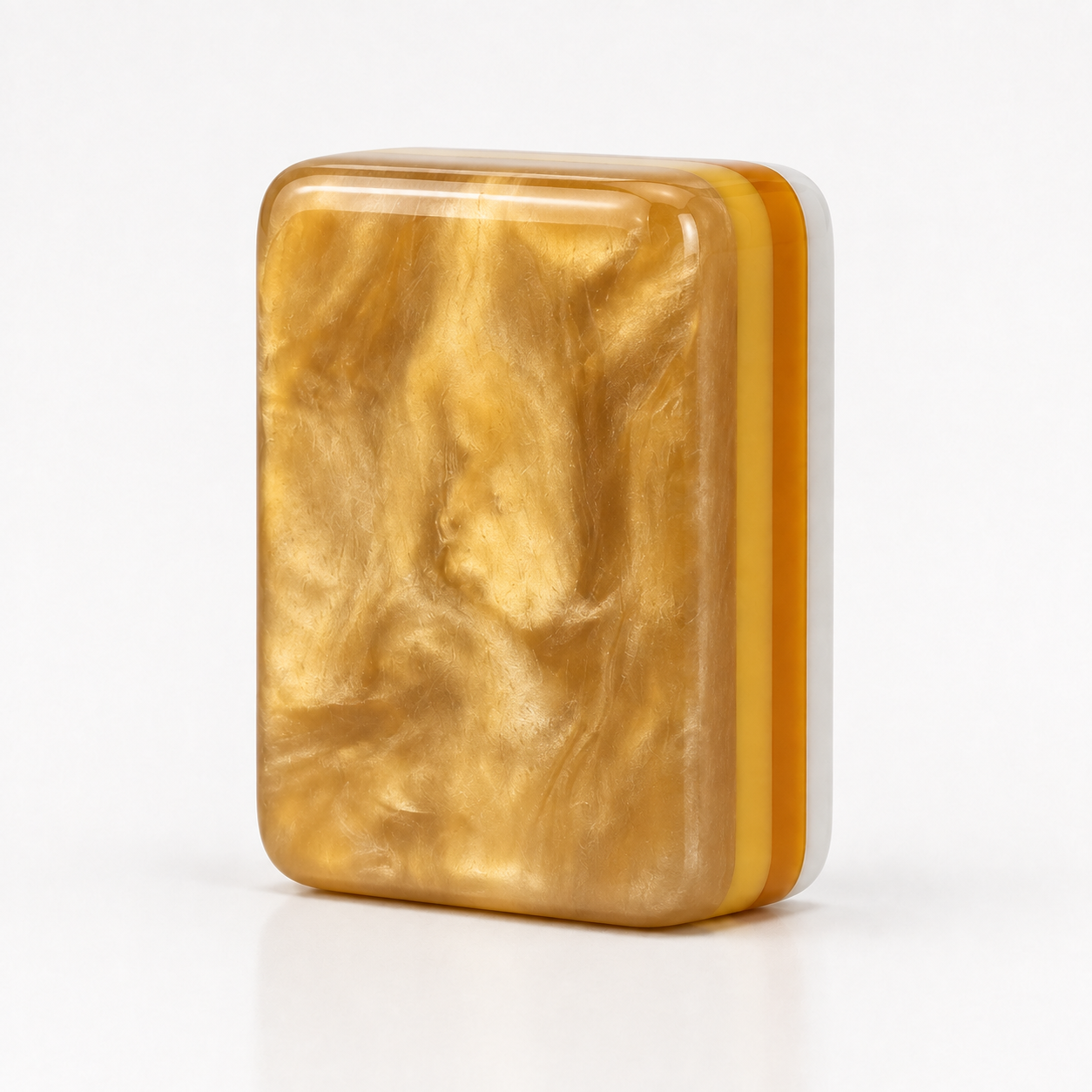 Pearlescent Gold Back edition showing face, side layers, and gold back