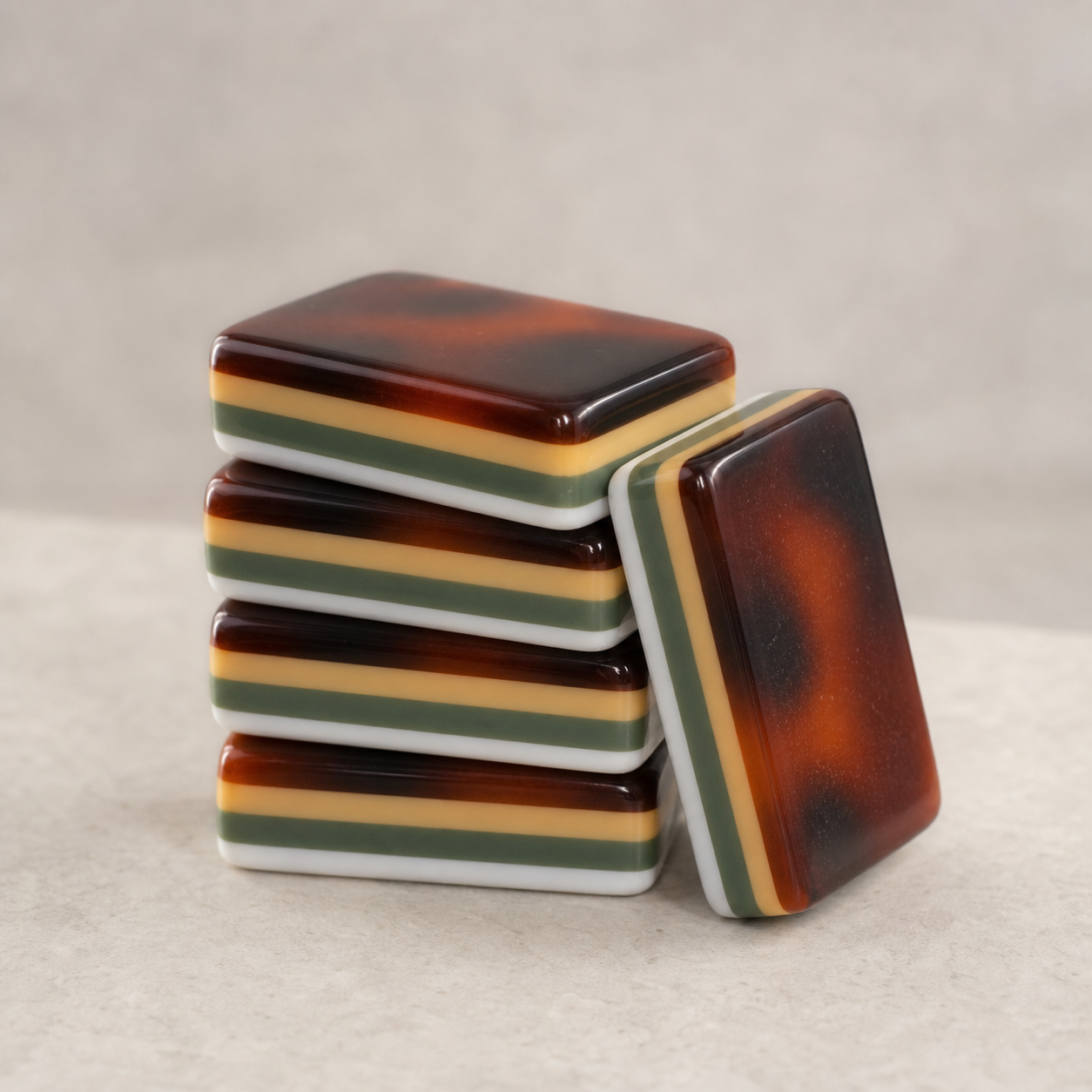 Amber Pavilion four-layer acrylic tile stack in high-key studio light
