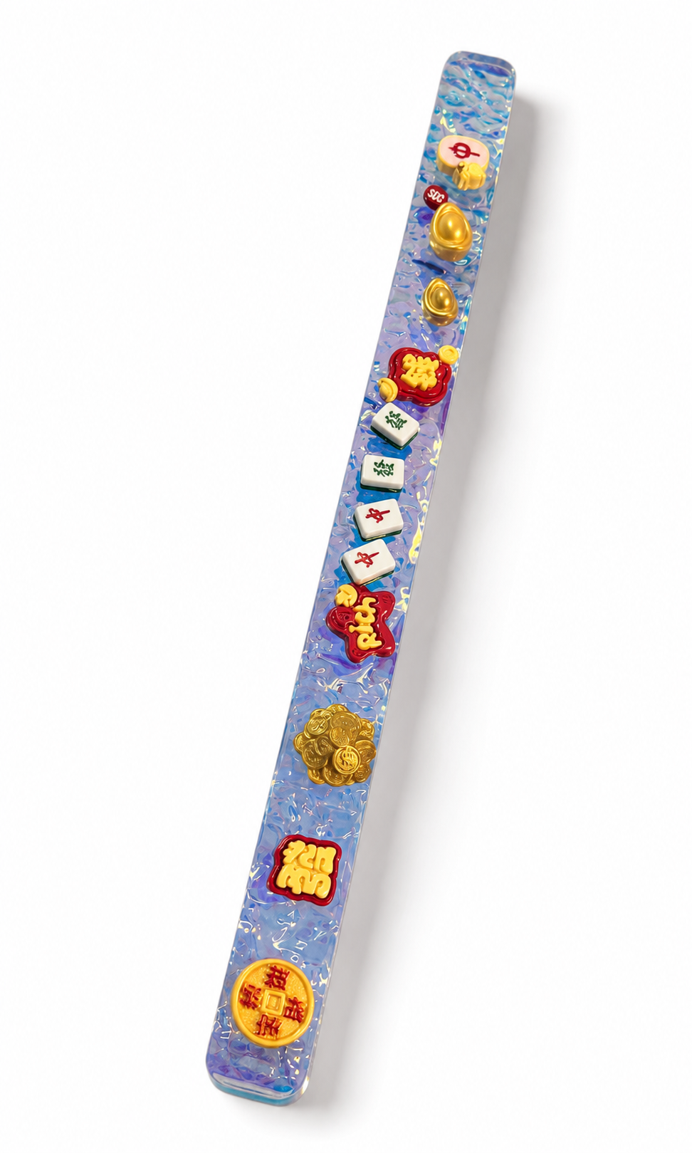 High-key studio detail of the Lucky Mahjong holographic pusher