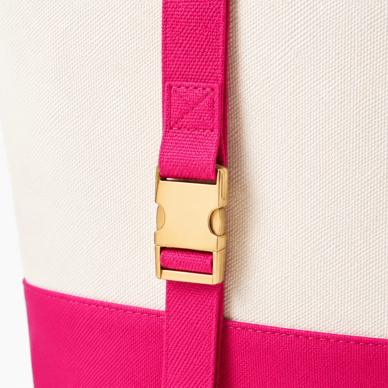 Close view of fuchsia tote webbing, stitching and buckle hardware