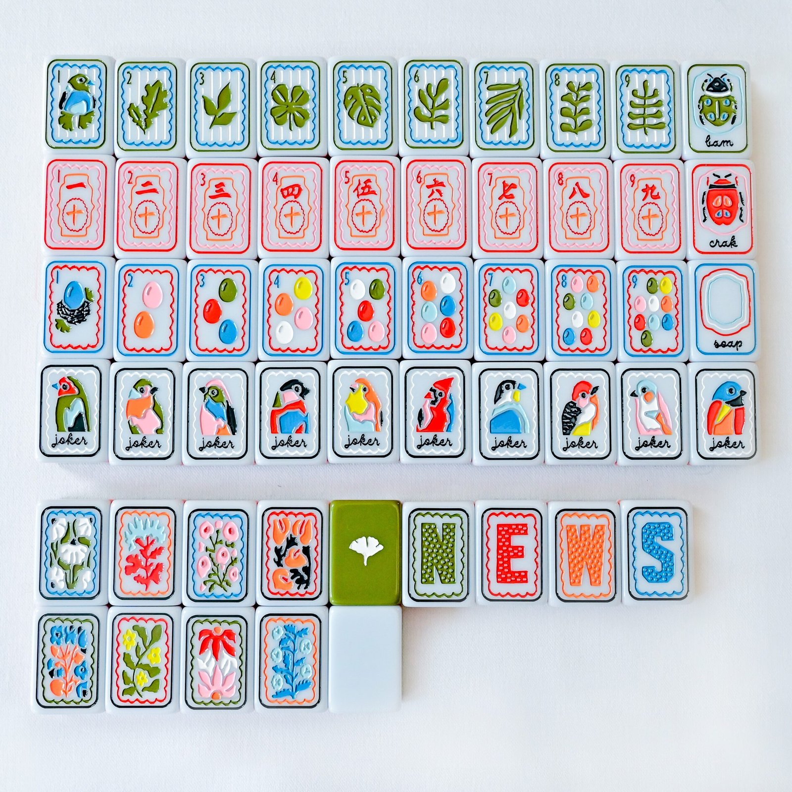 Birdsong and Ginkgo mahjong tiles with bird Jokers, botanical faces and white ginkgo motifs on olive backs