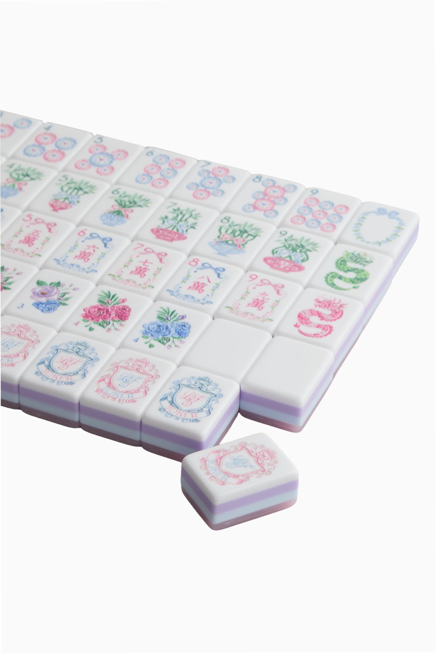 Blush Bow Garden mahjong tiles with pink bow backs, floral faces and pale blue and lilac edges